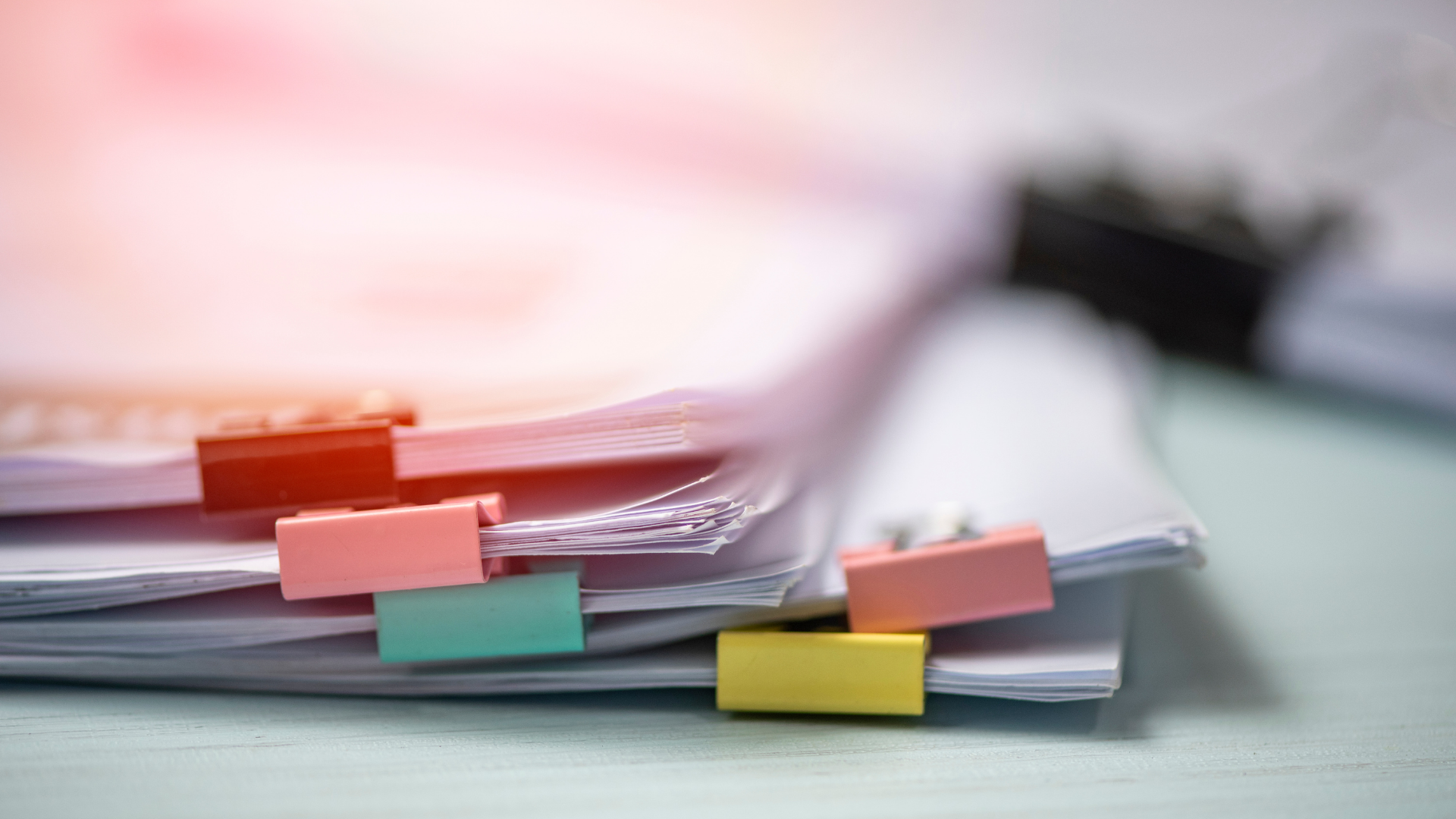 close up of a small stack of reports on a desk