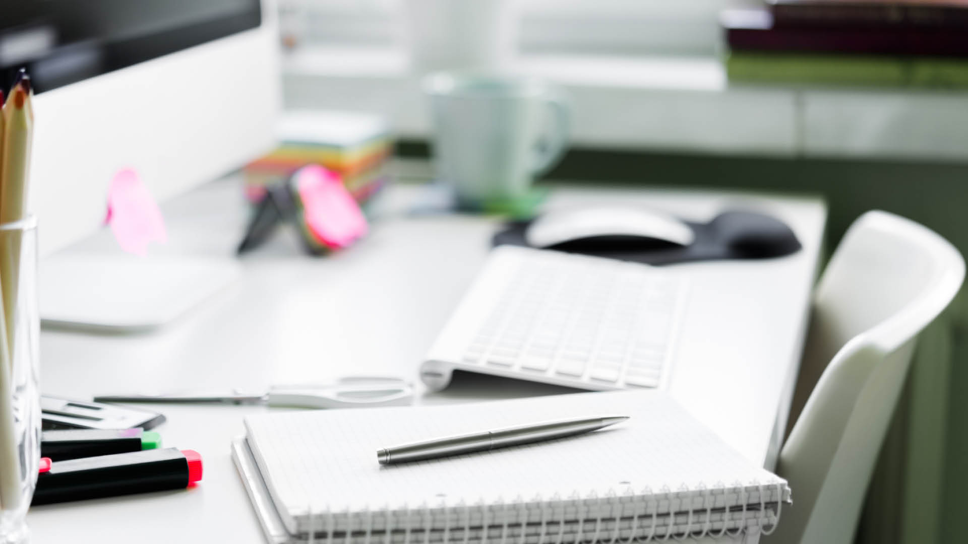 Close up of desk with papers.